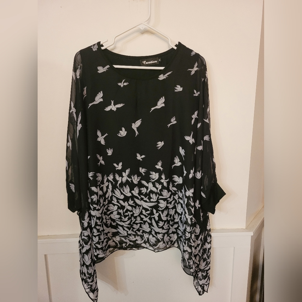Creations black, & white, butterfly sleeved top.